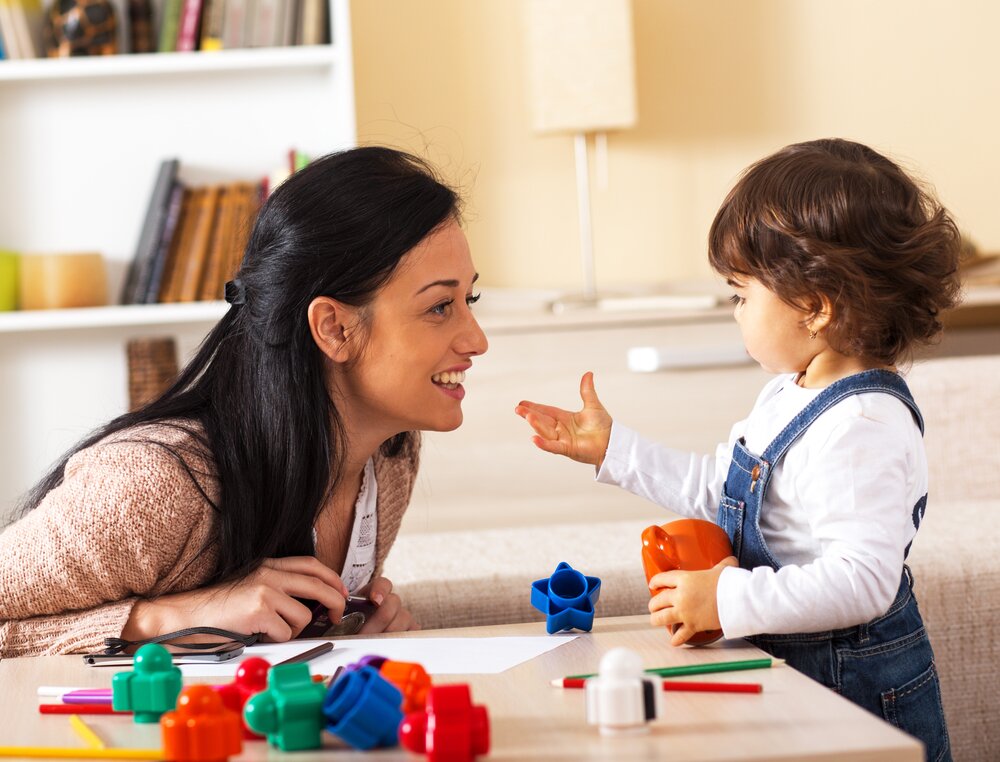 mom painting with child